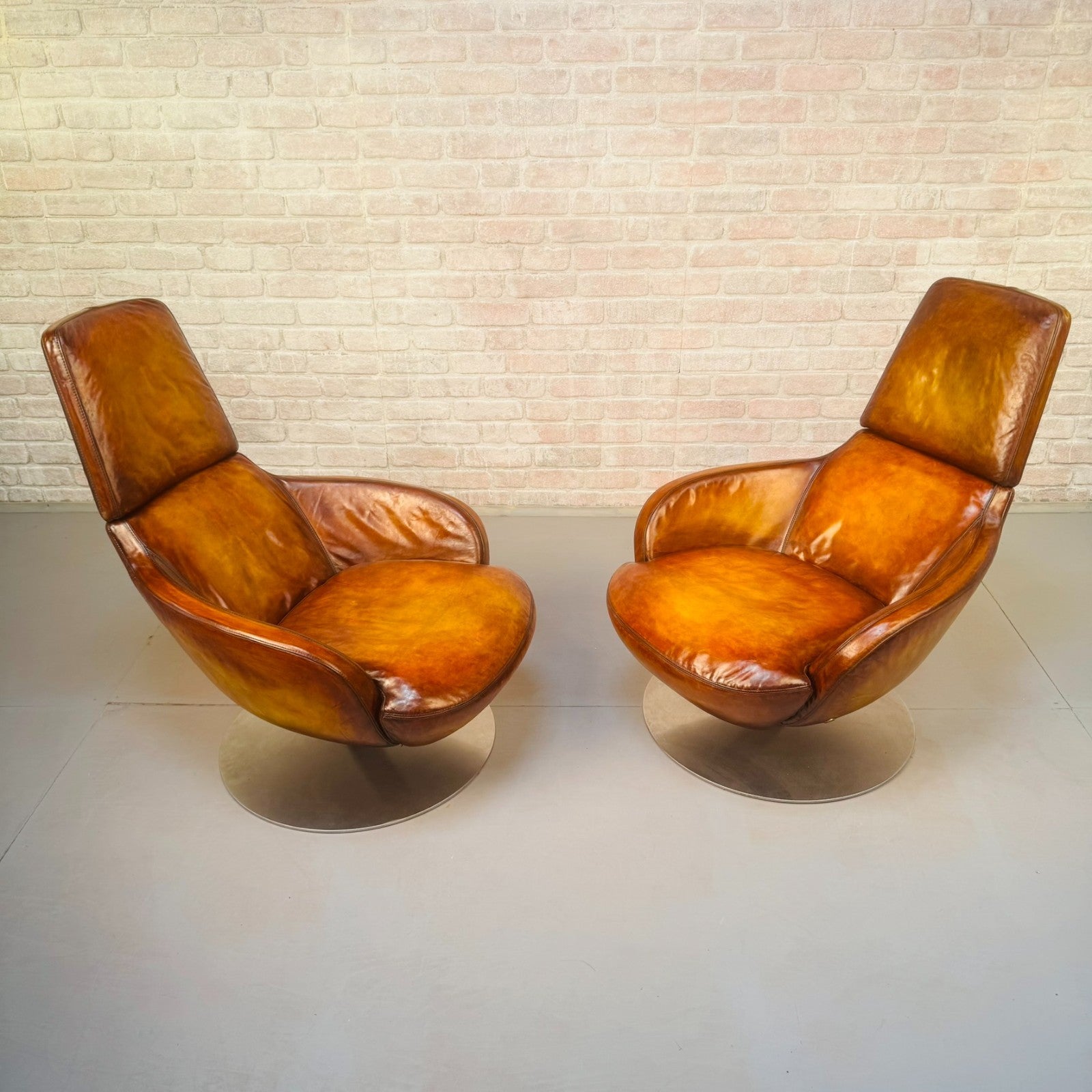 Pair of Vintage Italian Swivel Tan Leather Chairs