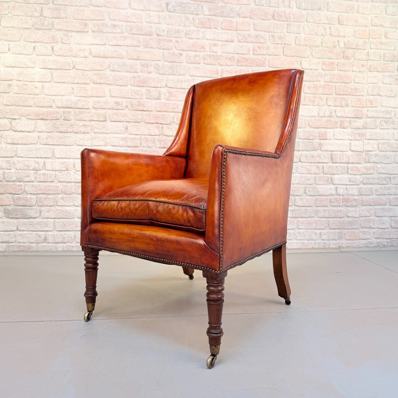 Circa 1910 Antique Tan Leather Armchair Hand Dyed Feather Cushions Castors