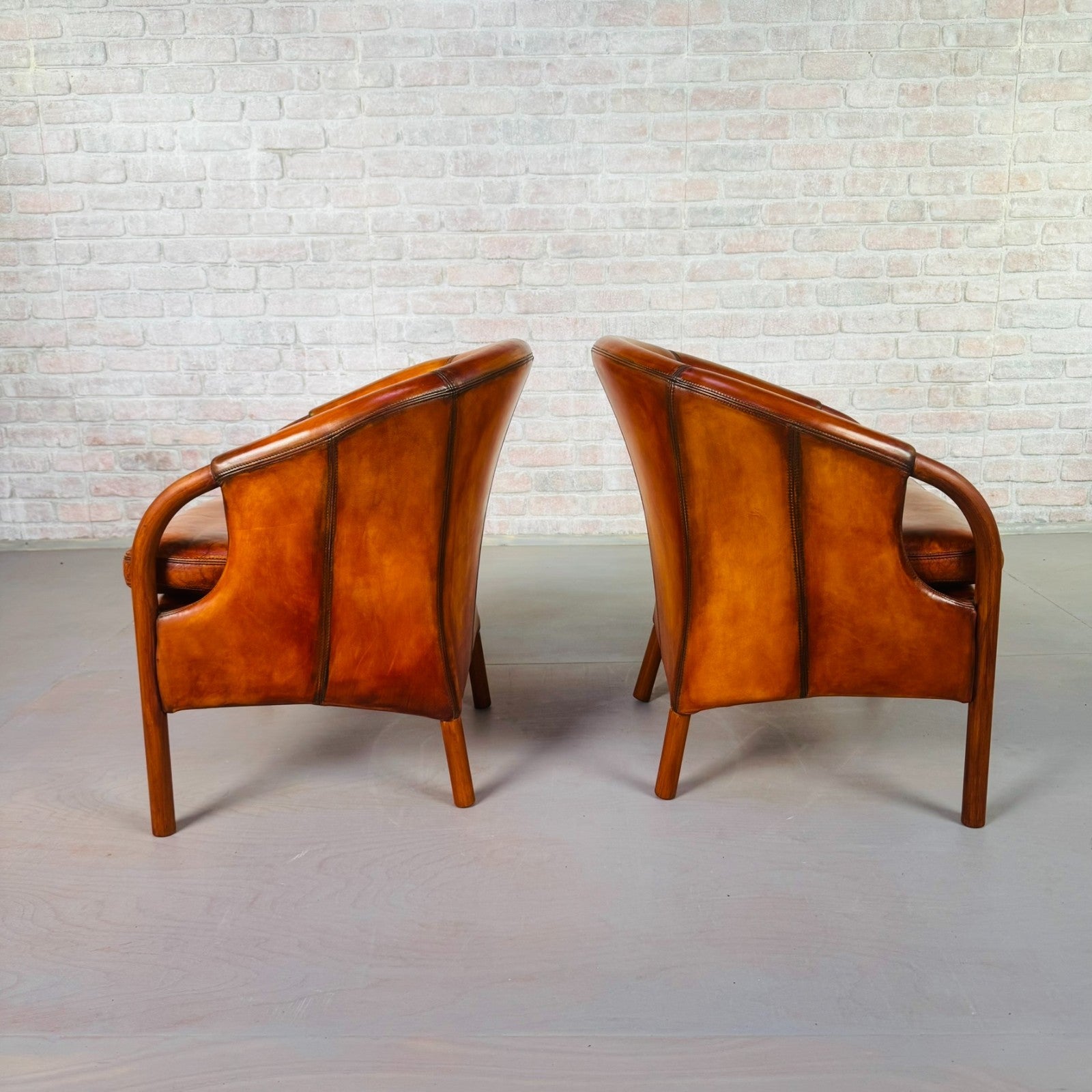 Pair of Vintage Danish Tan Leather Tub Chairs by Stouby