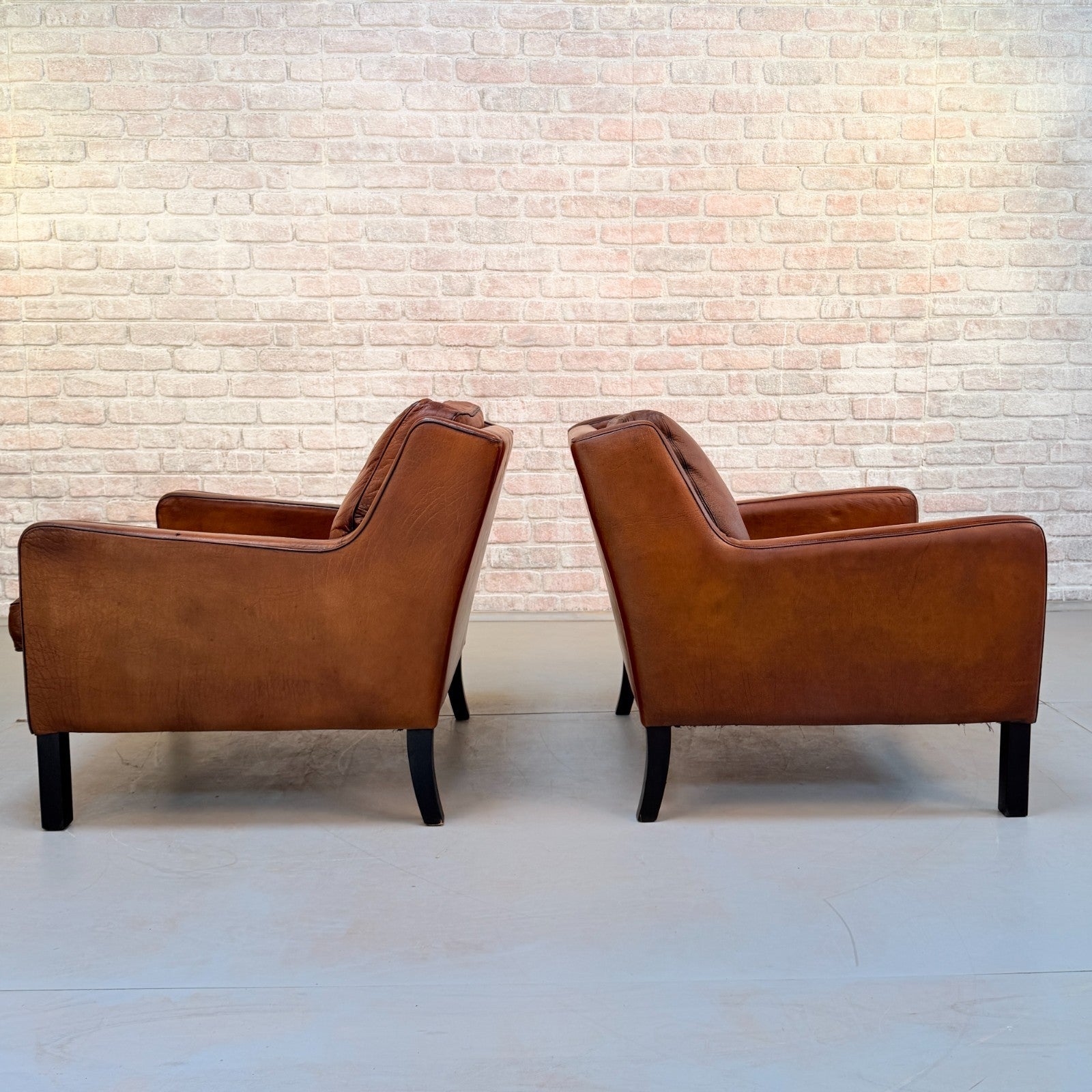 Vintage Near Pair Danish Tan Leather Armchairs Hand Dyed Feather Cushions