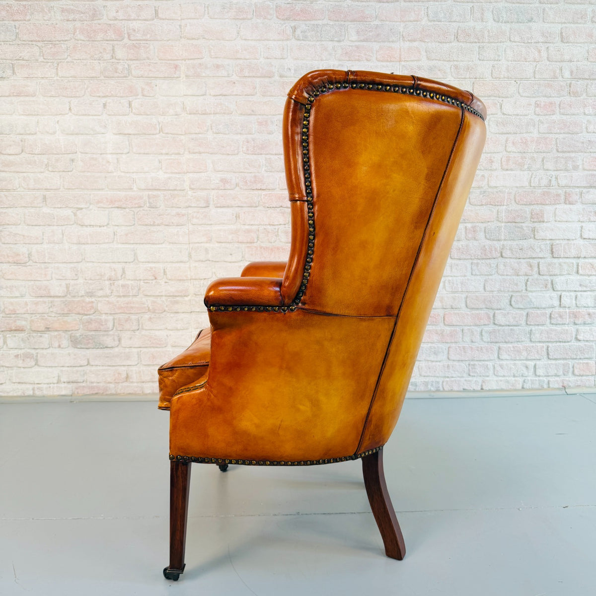 Vintage English Barrel Back Hand Dyed Tan Leather Wingback Armchair
