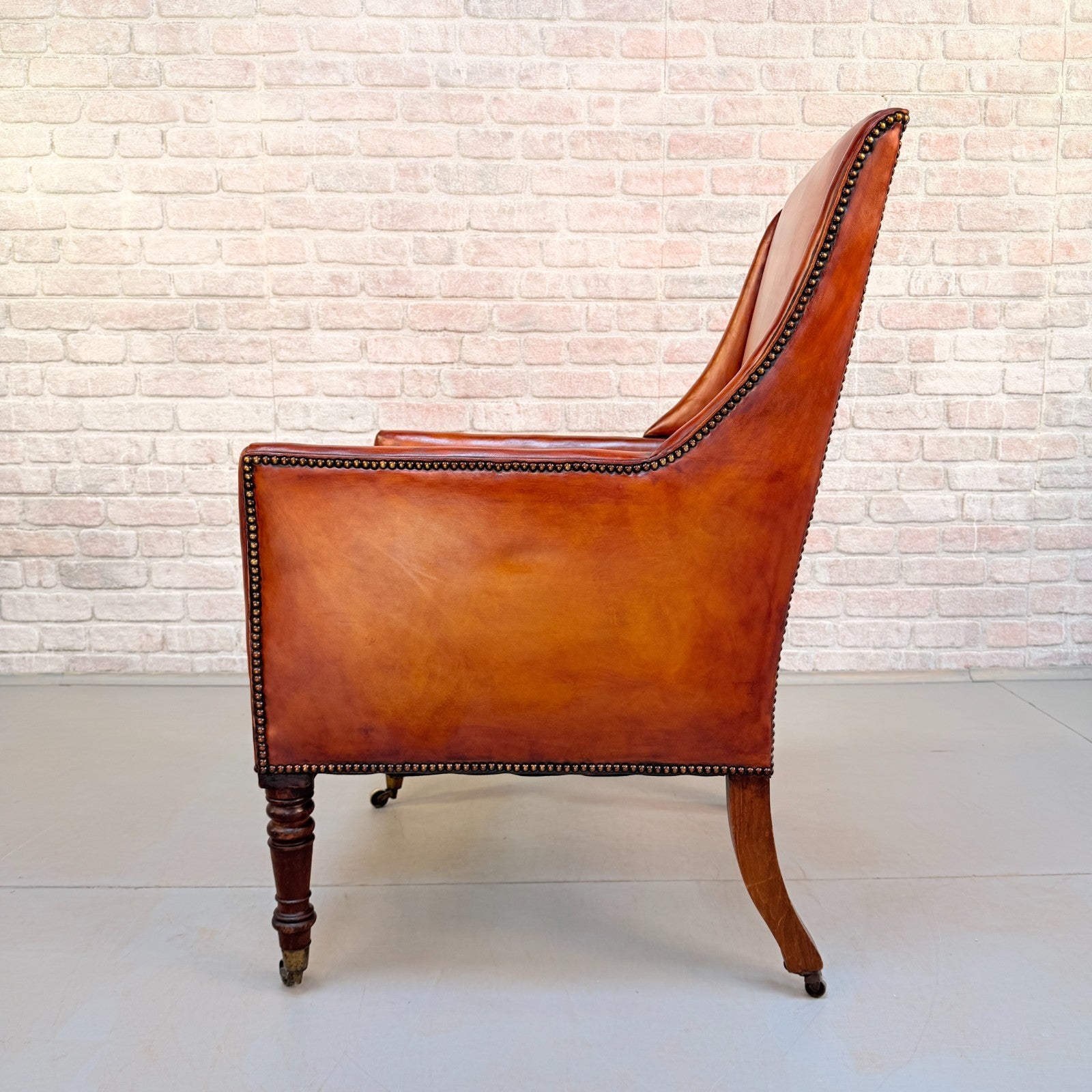 Circa 1910 Antique Tan Leather Armchair Hand Dyed Feather Cushions Castors
