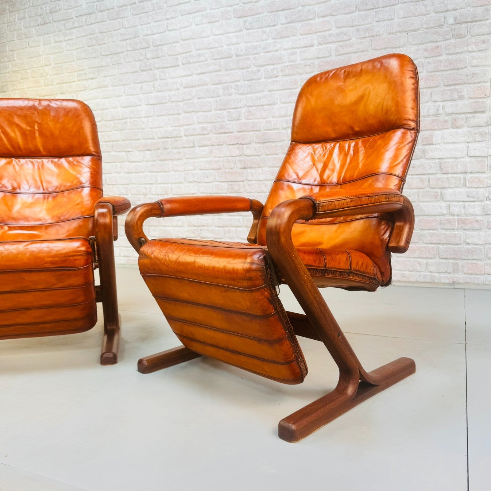 Pair of Vintage Danish Zero Gravity Reclining Tan Leather Armchairs Teak Frame