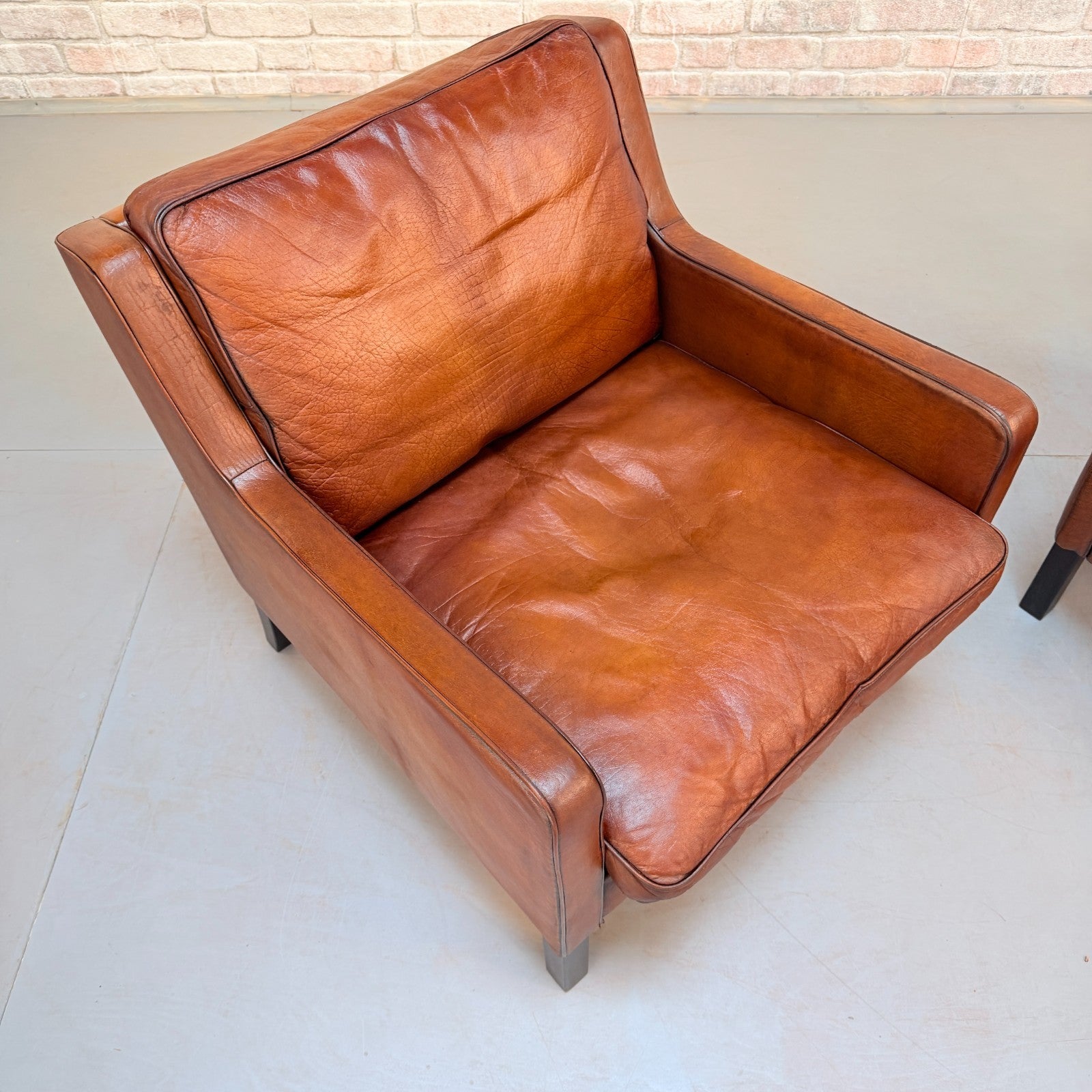 Vintage Near Pair Danish Tan Leather Armchairs Hand Dyed Feather Cushions