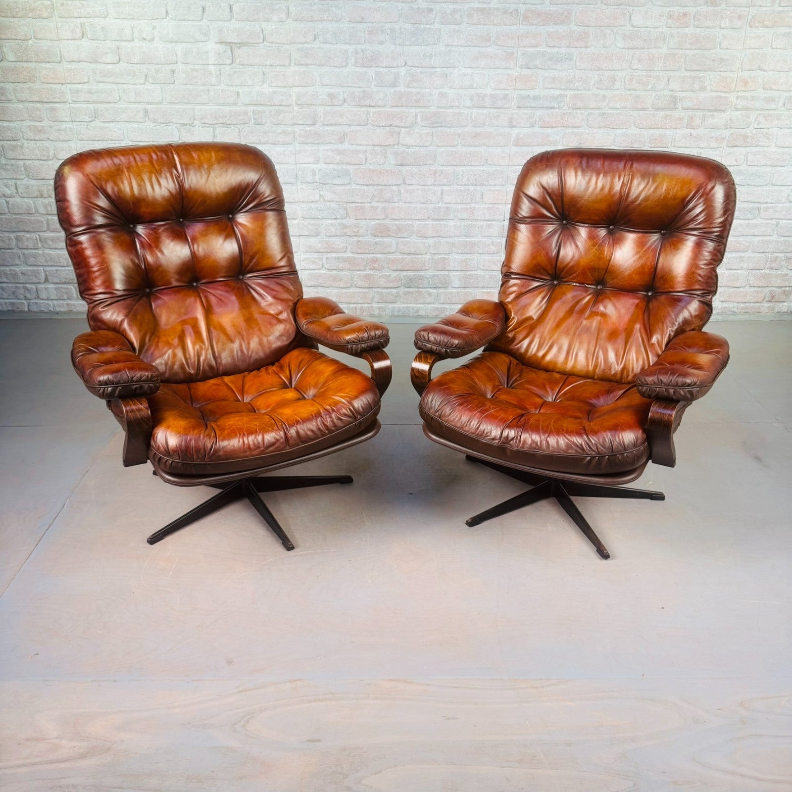 Pair of Vintage Danish Tan Leather Swivel Chairs  Stylish