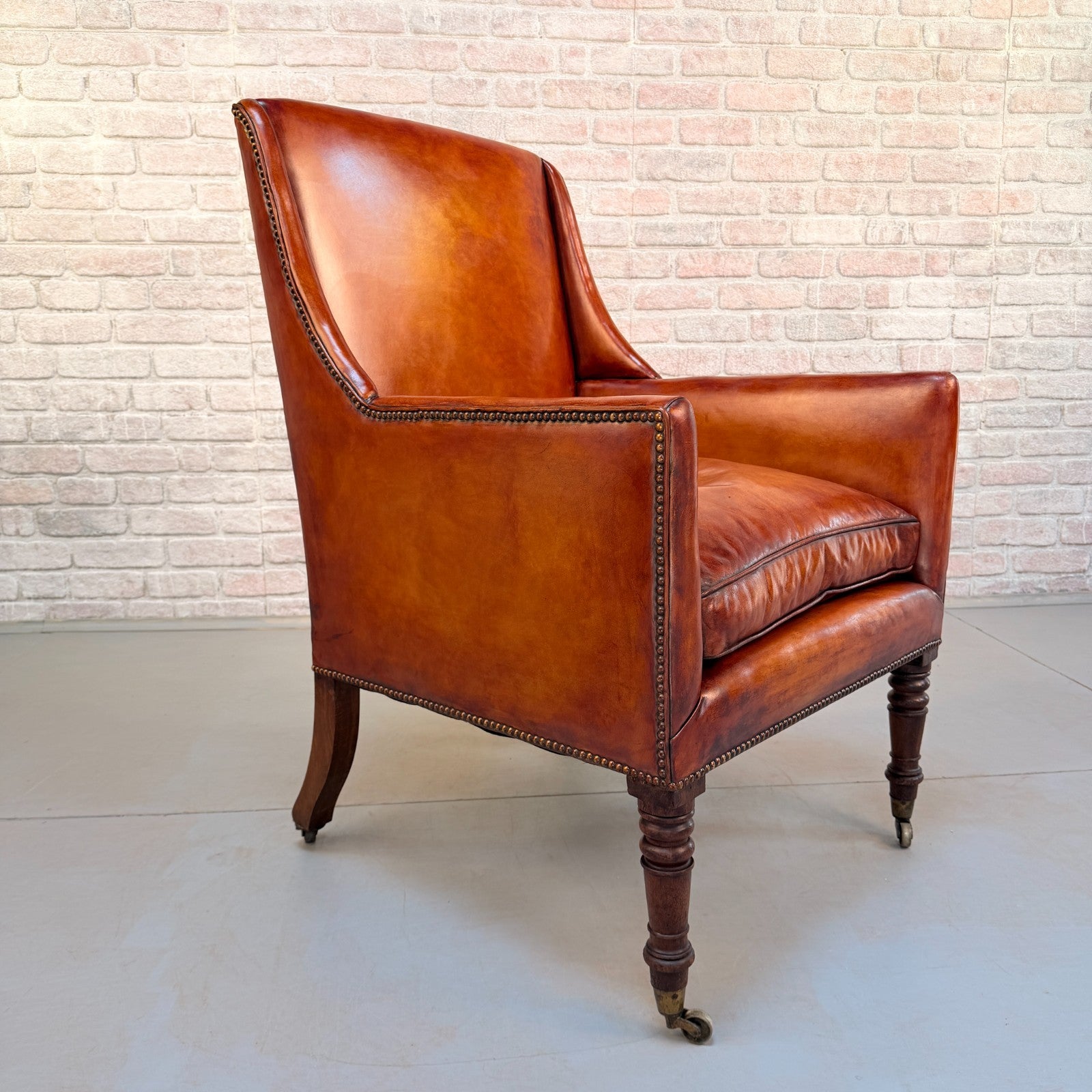 Circa 1910 Antique Tan Leather Armchair Hand Dyed Feather Cushions Castors