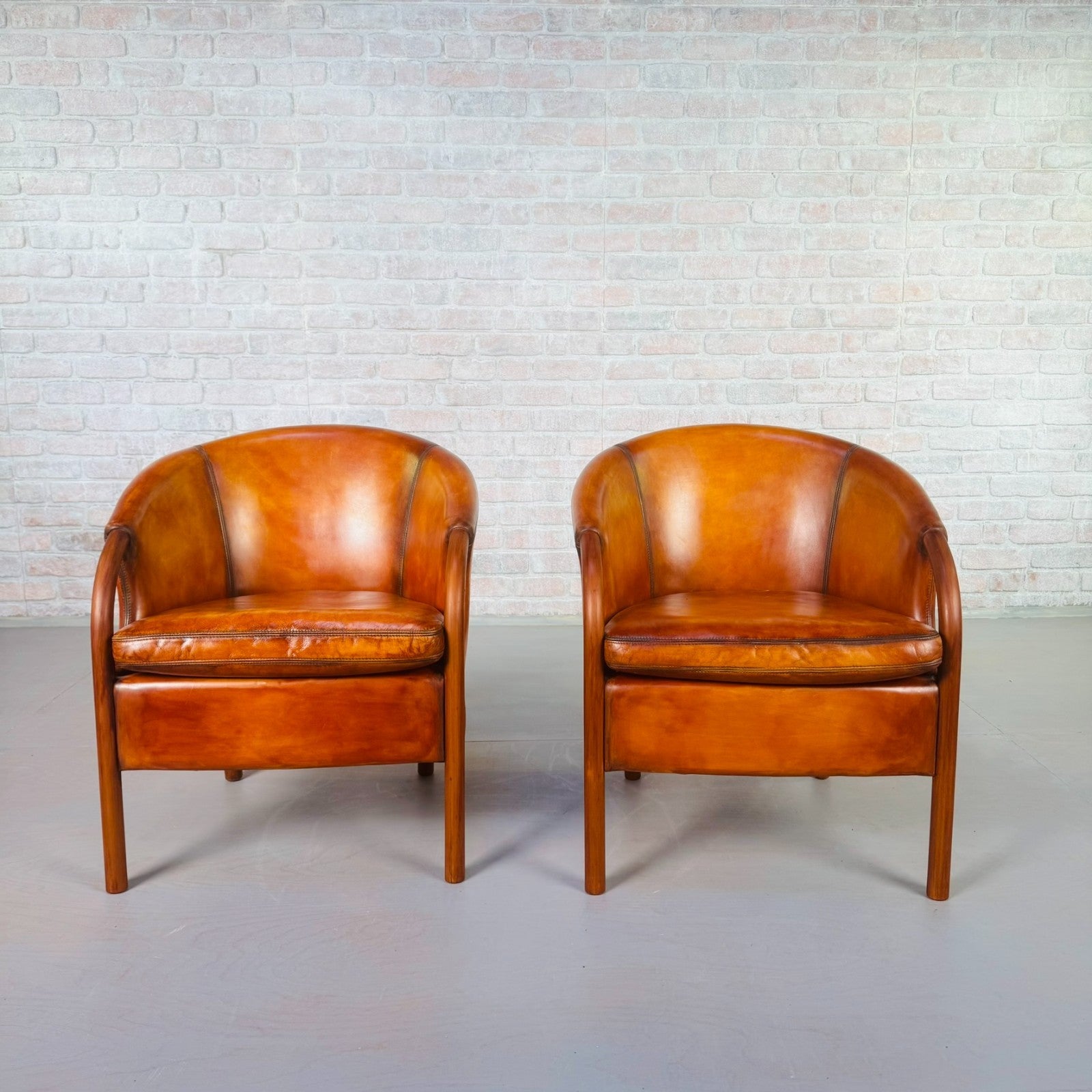 Pair of Vintage Danish Tan Leather Tub Chairs by Stouby