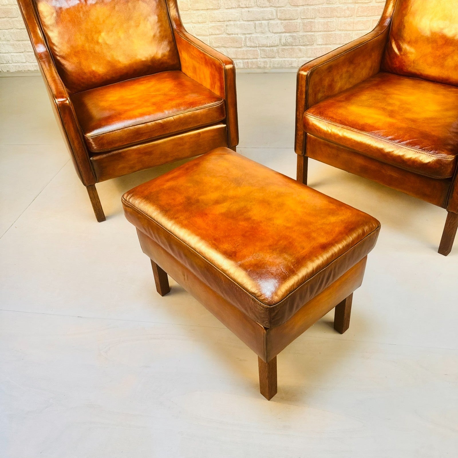 Pair Vintage Danish Wingback Chairs & Footstool Tan Leather Lounge Set