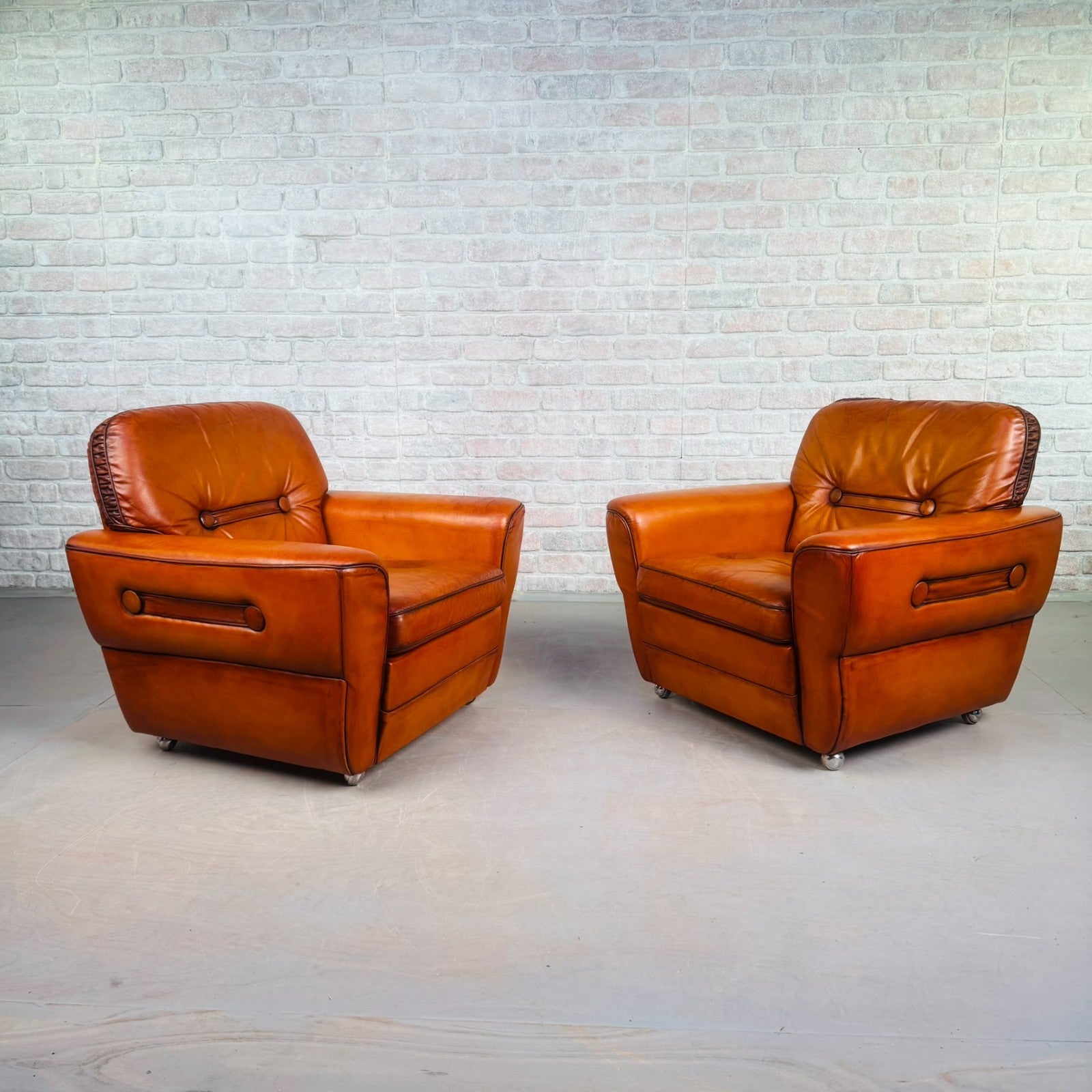Pair of Elegant Danish Tan Leather Lounge Chairs