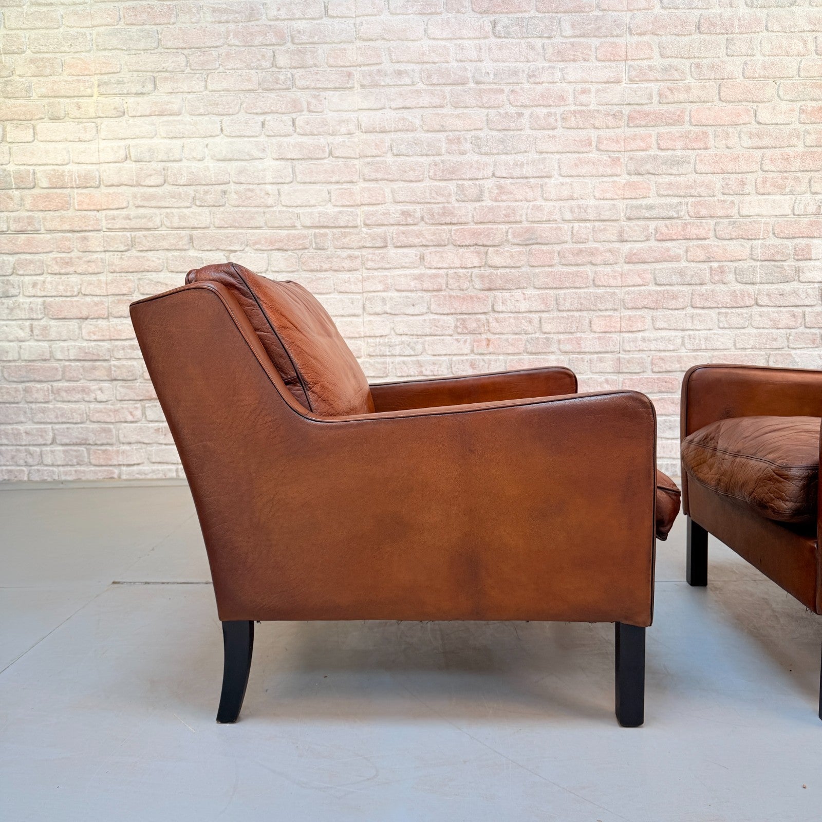 Vintage Near Pair Danish Tan Leather Armchairs Hand Dyed Feather Cushions