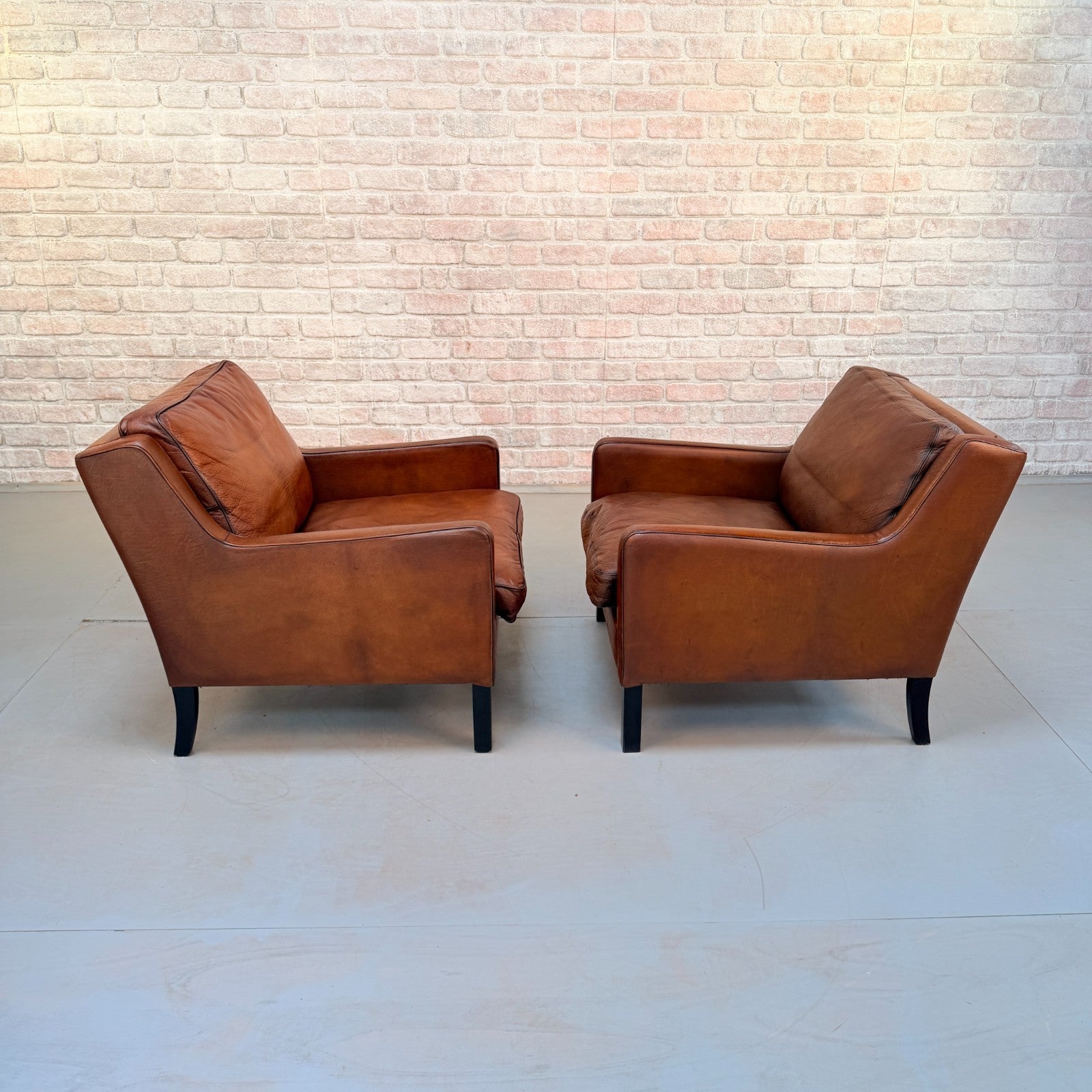 Vintage Near Pair Danish Tan Leather Armchairs Hand Dyed Feather Cushions