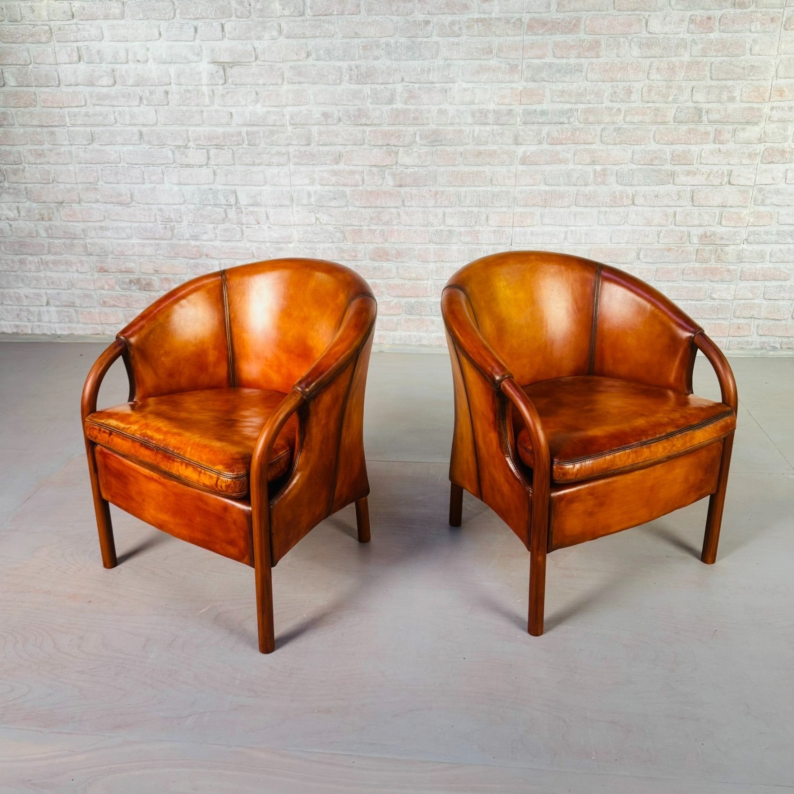 Pair of Vintage Danish Tan Leather Tub Chairs by Stouby