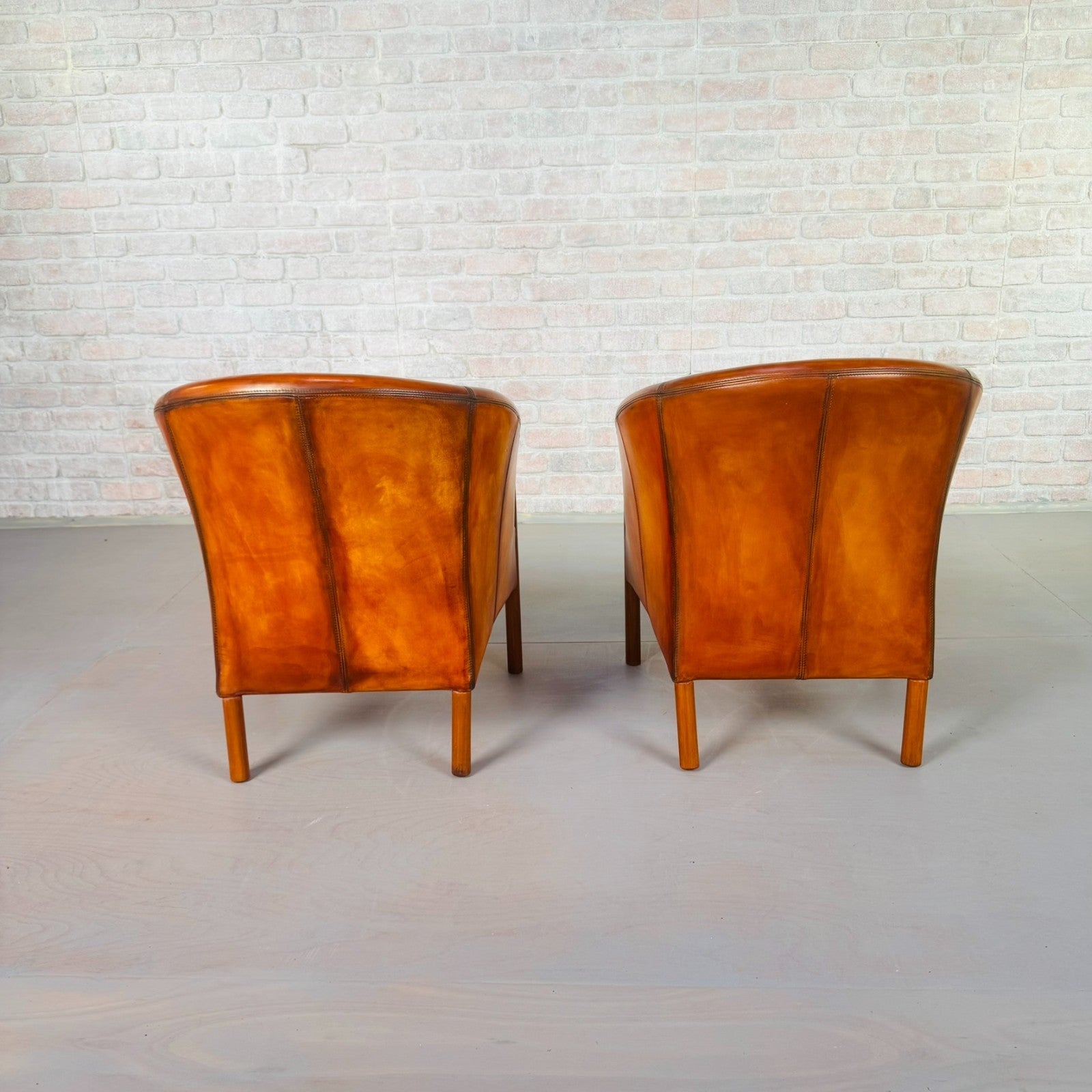 Pair of Vintage Danish Tan Leather Tub Chairs by Stouby