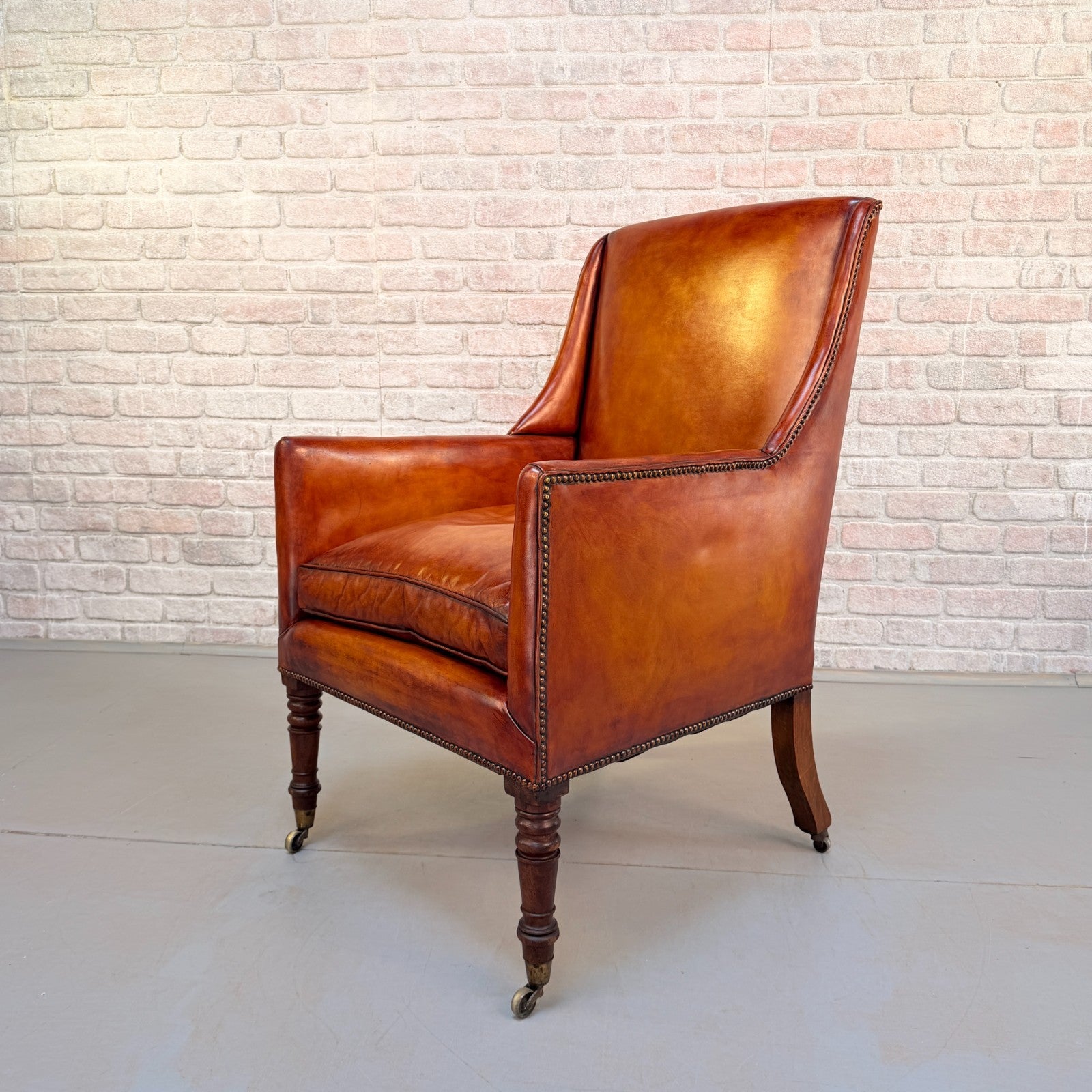 Circa 1910 Antique Tan Leather Armchair Hand Dyed Feather Cushions Castors