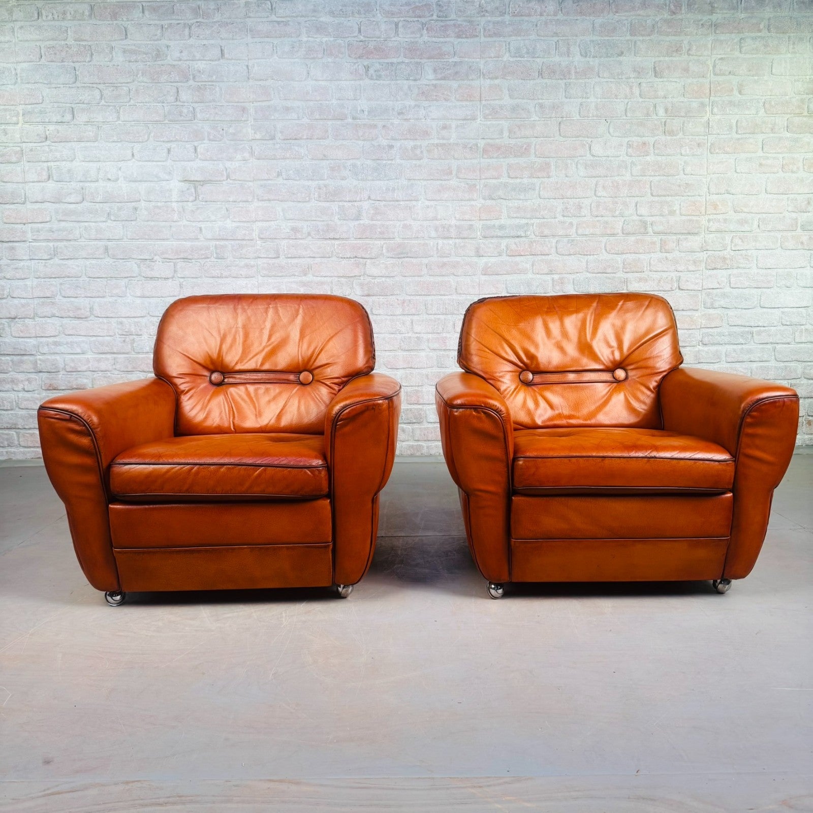 Pair of Elegant Danish Tan Leather Lounge Chairs
