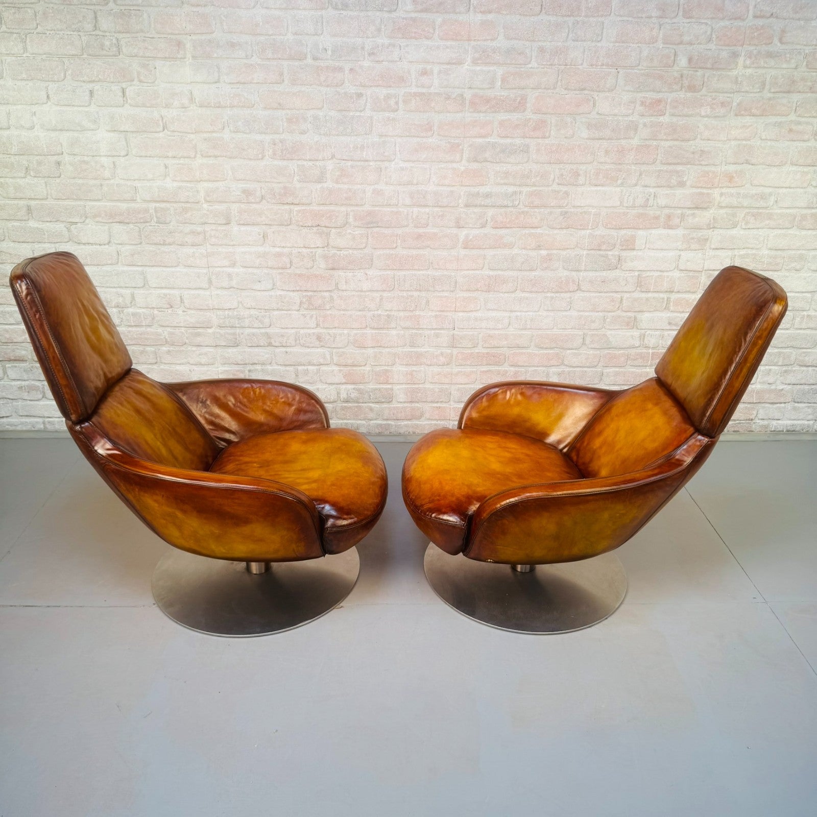 Pair of Vintage Italian Swivel Tan Leather Chairs