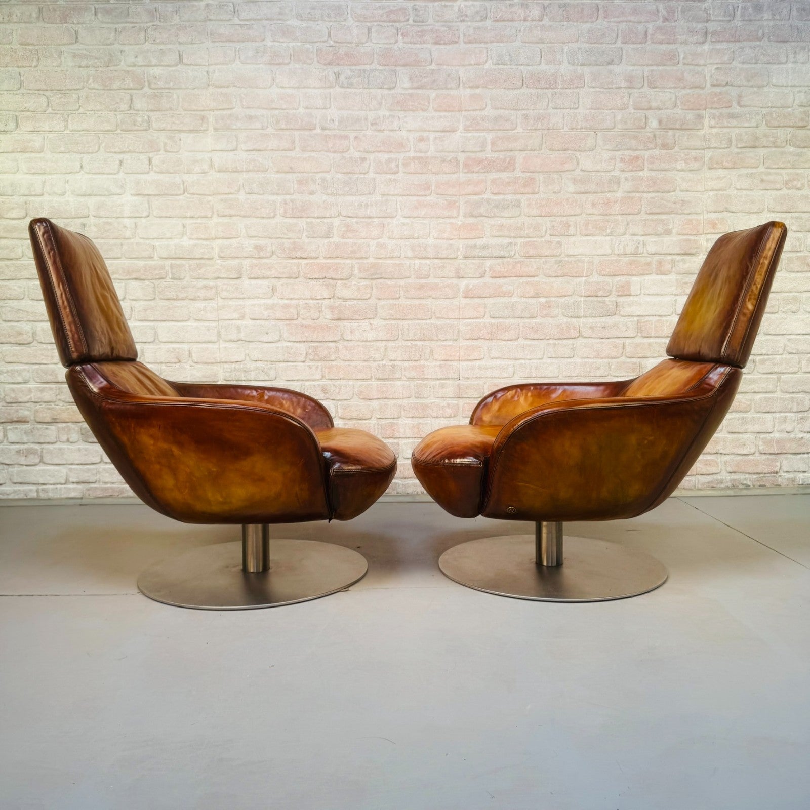Pair of Vintage Italian Swivel Tan Leather Chairs