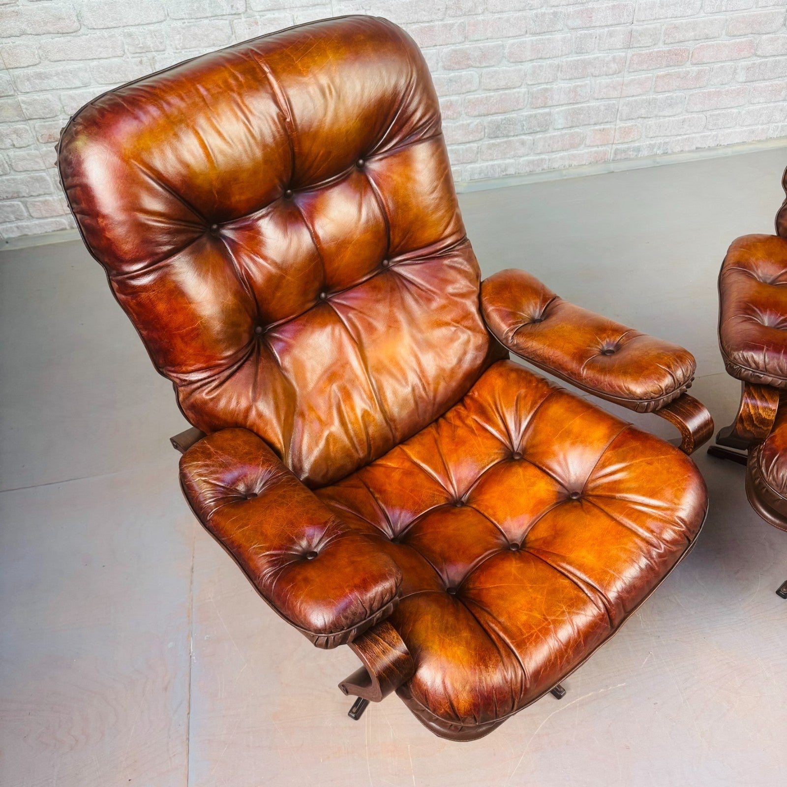Pair of Vintage Danish Tan Leather Swivel Chairs  Stylish