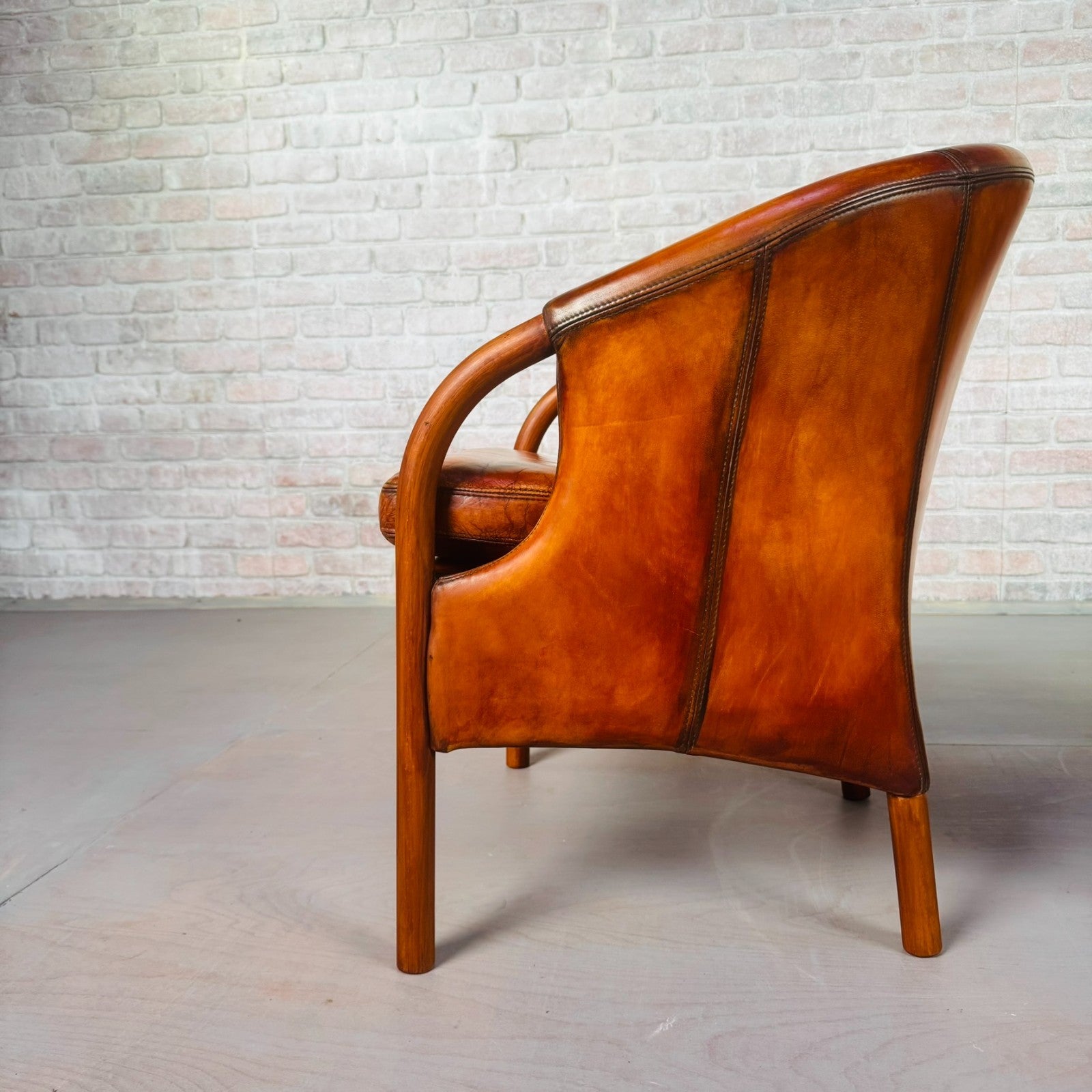 Pair of Vintage Danish Tan Leather Tub Chairs by Stouby