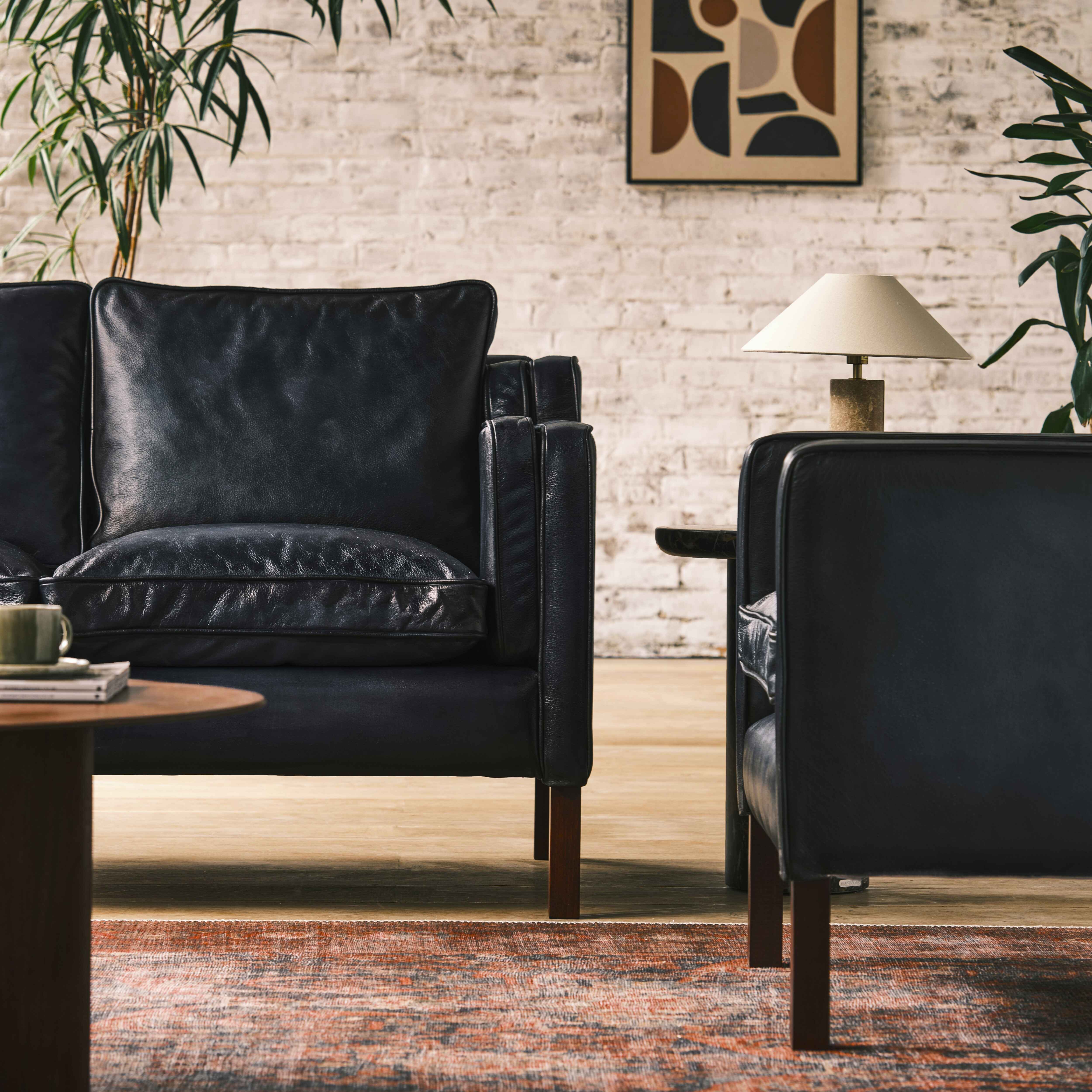 luxury-hand-dyed-mid-century-black-leather-two-seater-sofa-loft-front-close