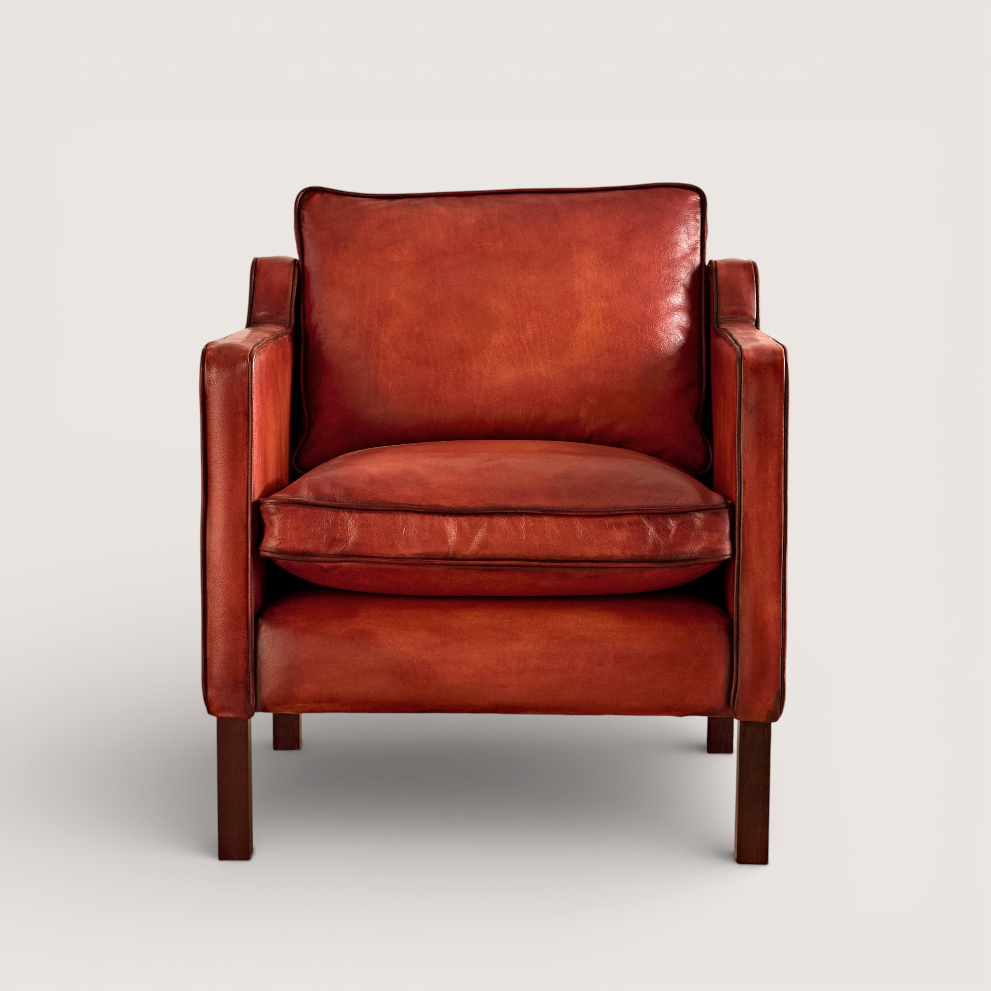 luxury-hand-dyed-mid-century-cognac-tan-leather-armchair-white-background-front