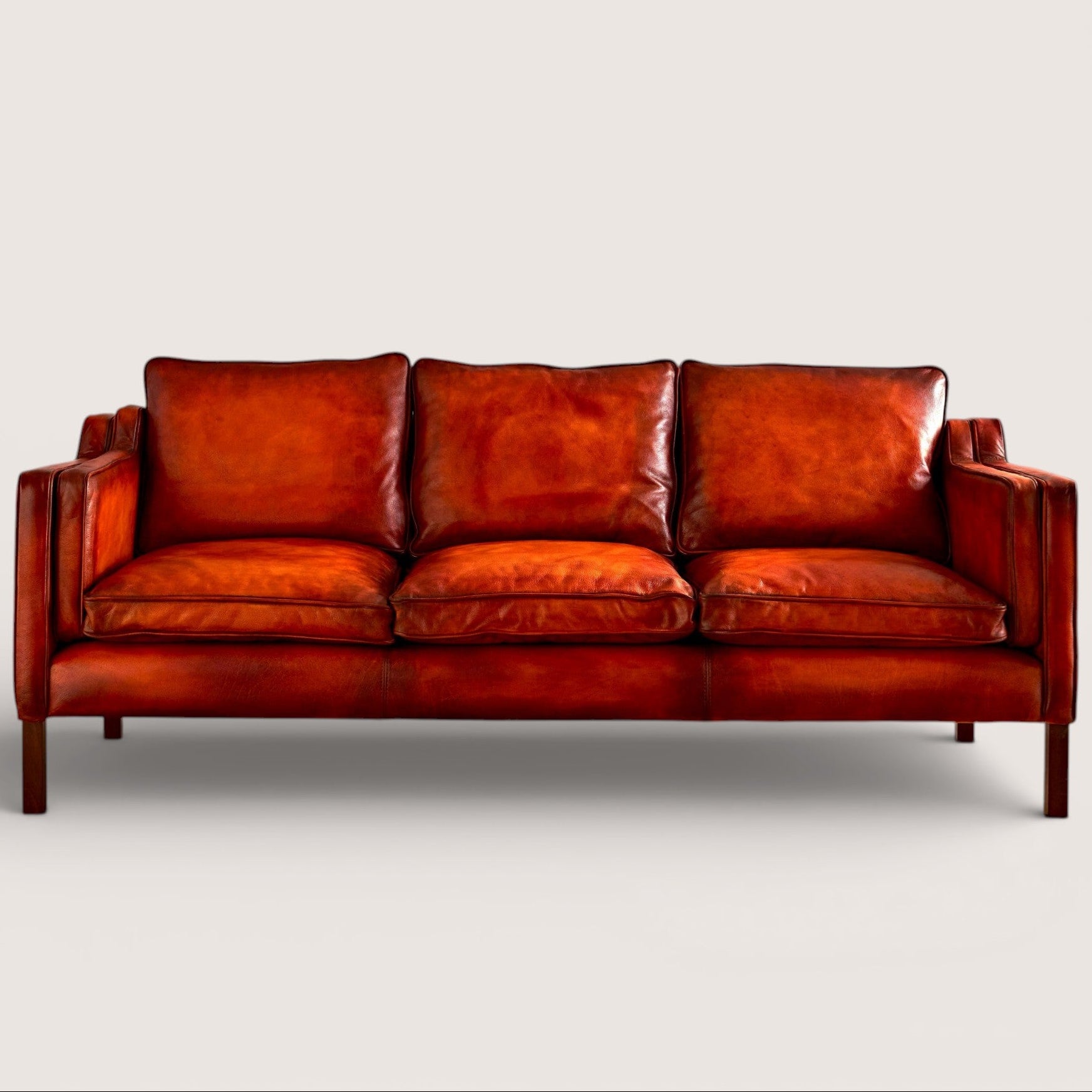 luxury-hand-dyed-mid-century-cognac-tan-leather-three-seater-sofa-white-background-front