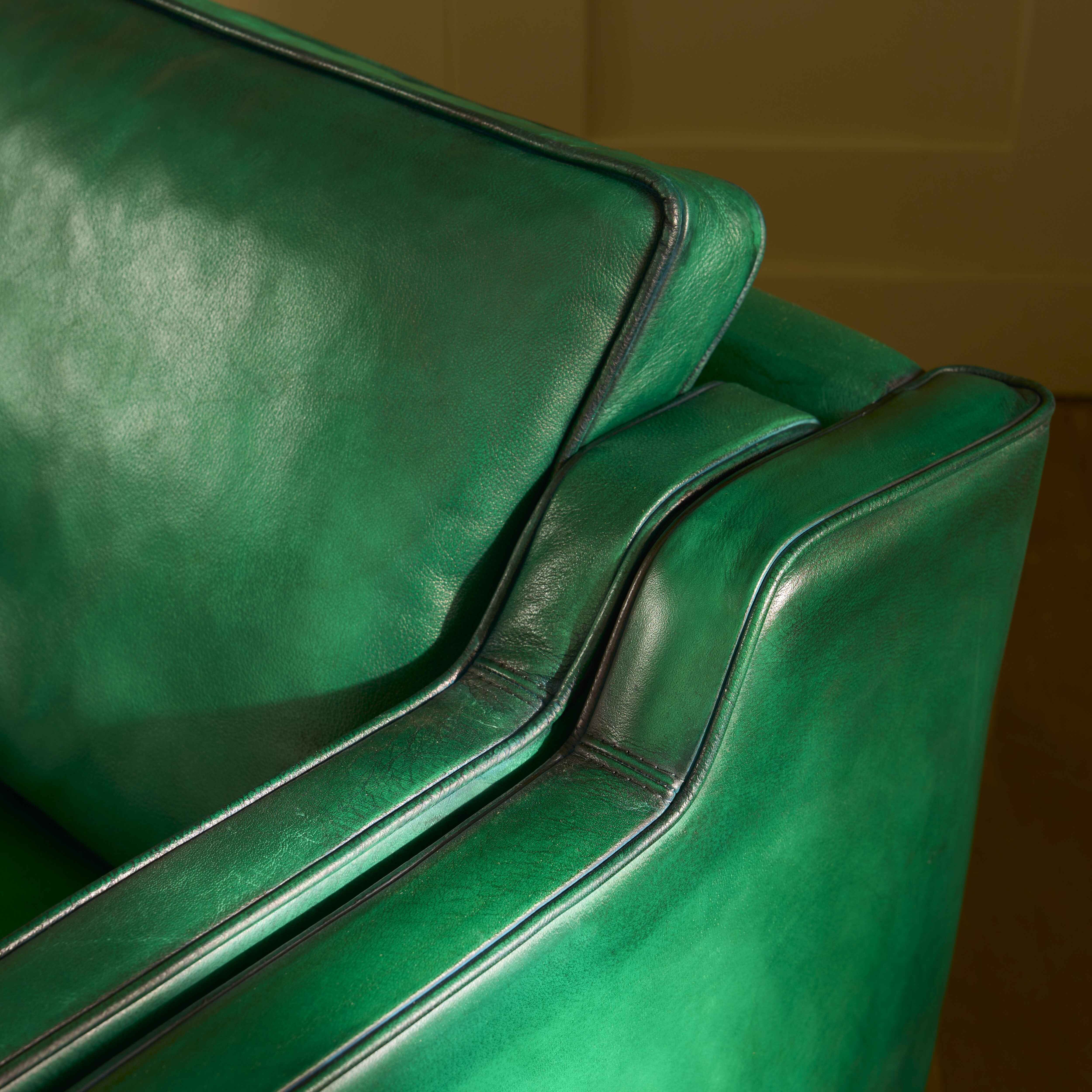 luxury-hand-dyed-mid-century-green-leather-two-seater-sofa-cottage-close-stitching