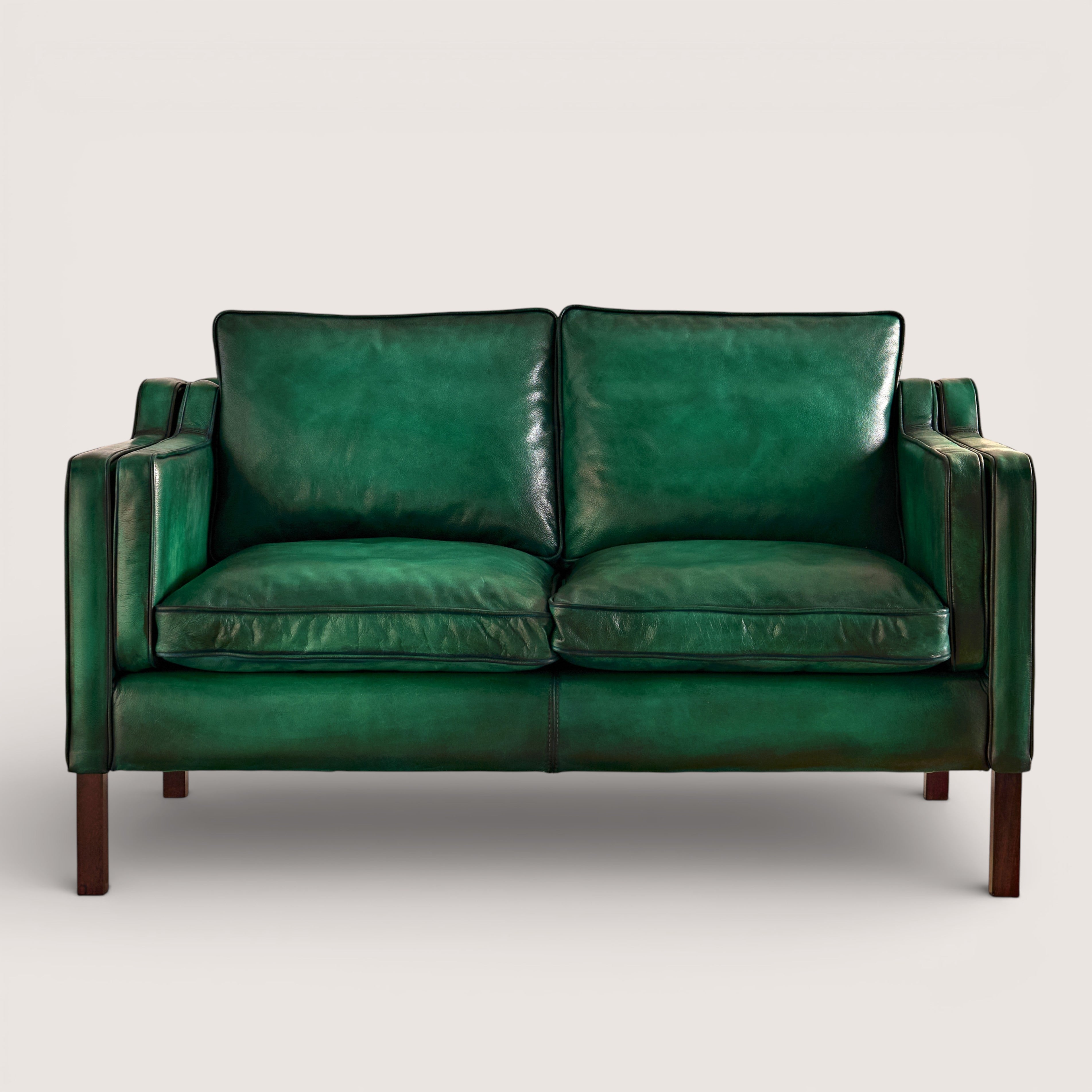 luxury-hand-dyed-mid-century-green-leather-two-seater-sofa-white-background-front