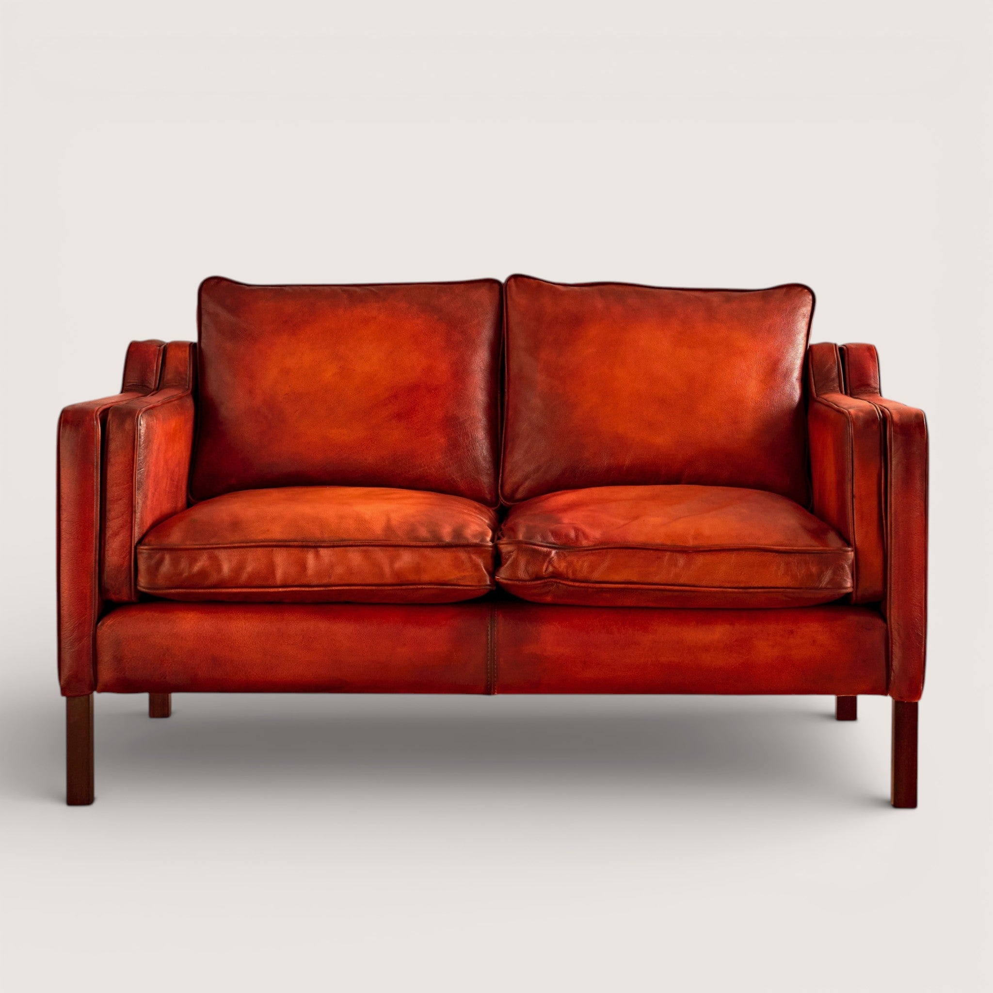luxury-hand-dyed-mid-century-leather-two-seater-sofa-white-background-front