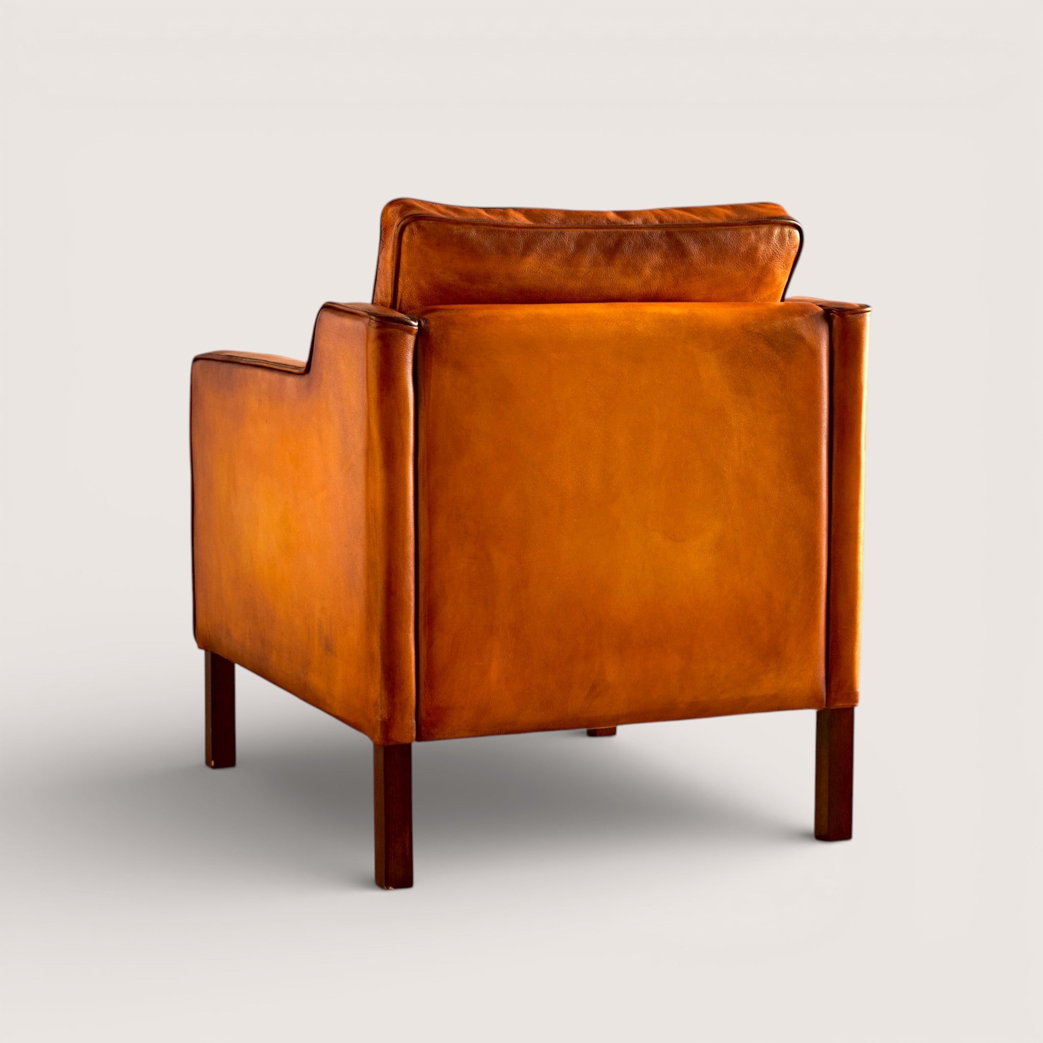 luxury-hand-dyed-mid-century-tan-leather-armchair-white-background-back